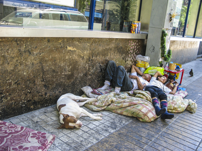 homeless people life and sleep on the road in Santiago
