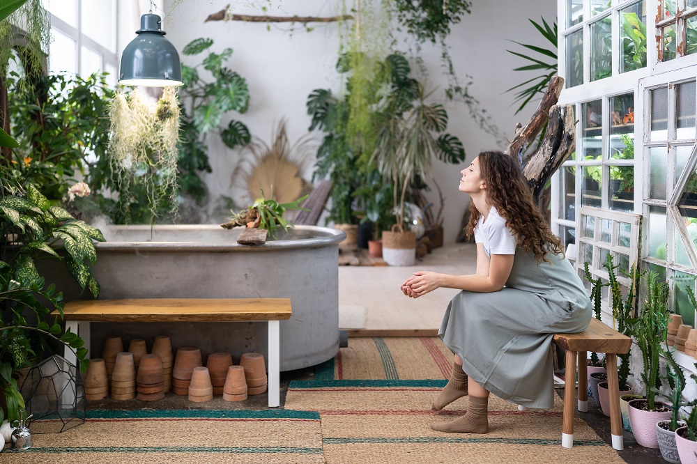 Sad,Pensive,Woman,Sits,On,Bench,In,Home,Garden,,Thinking