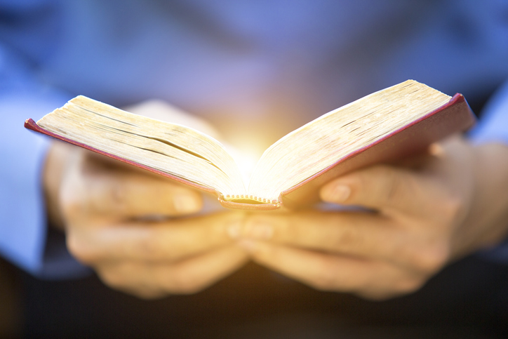 A man reading the Holy Bible.