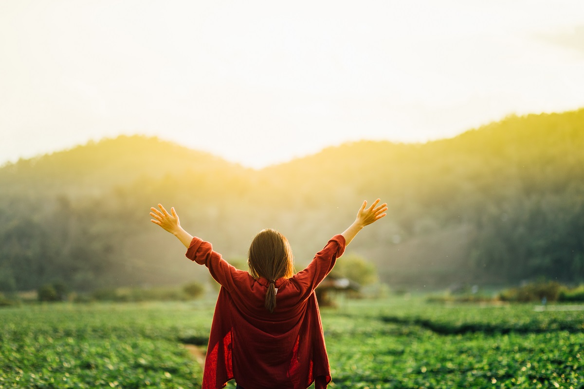 Girl,Thanks,For,Giving,In,Sunset.raised,Hands,At,Mountains.