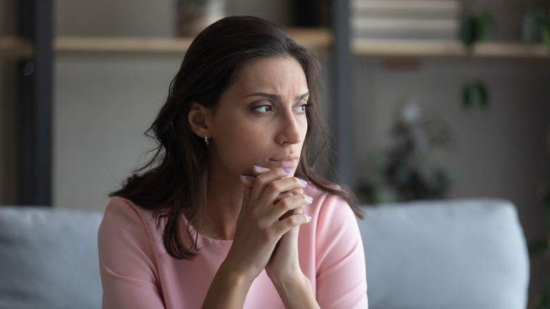 Anxious Arabic woman feel unhappy thinking at home