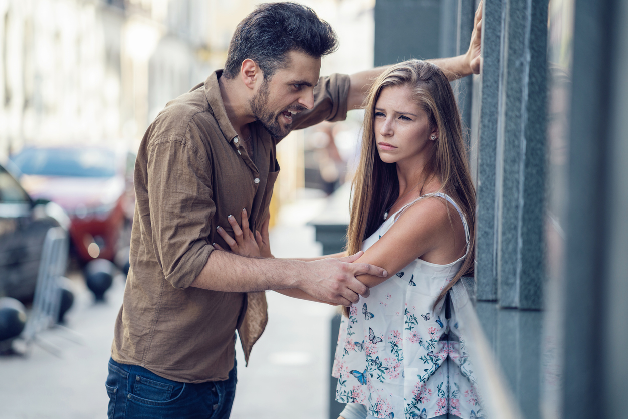 Man shouting with anger at his spouse on the street
