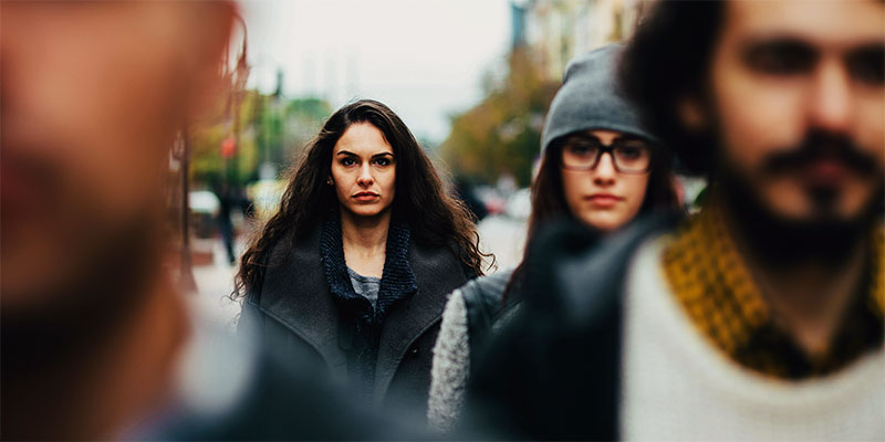 Serious woman in the crowd