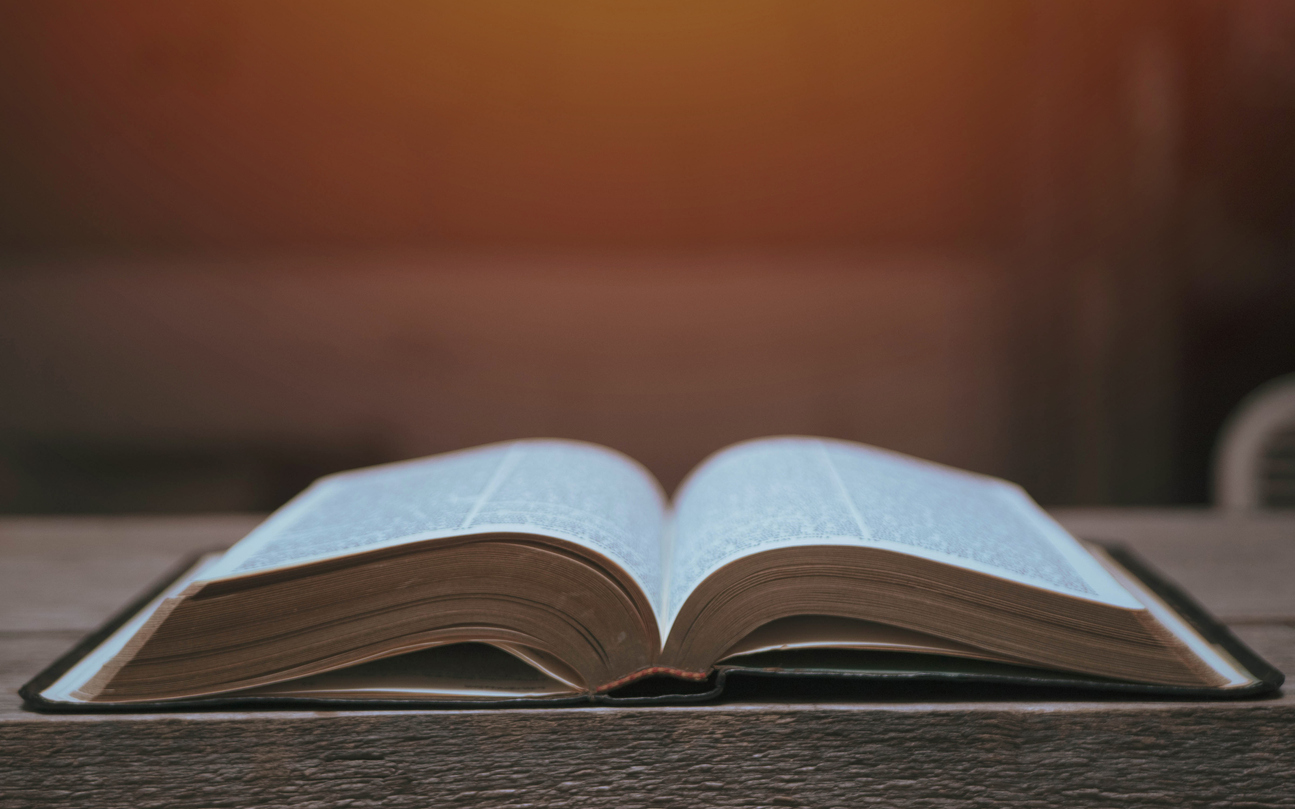 Open Bible on a Slate Tabletop with Customizable Space to Add Text