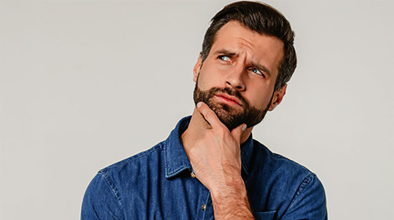 Pensive thoughtful contemplating caucasian young man thinking about future, planning new startup looking upwards isolated in white background