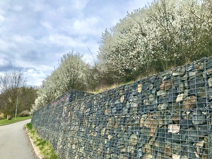 Crushed stone wall to protect soil movements