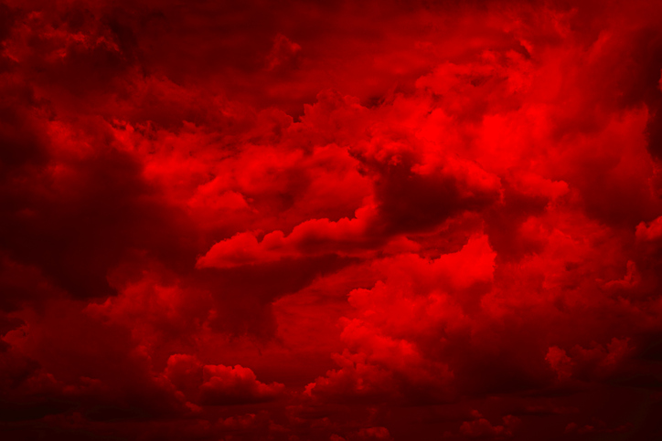 Black blood red fiery sky with clouds. Horror background . Ominous skies. Hell.