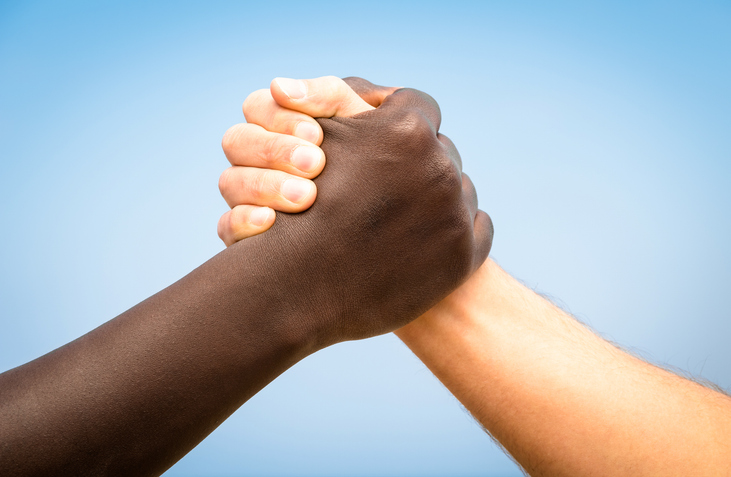 Black and white human hands &#8211; Handshake against racism