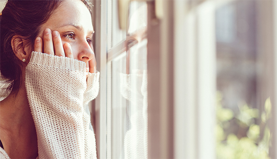 Girl looking through the window