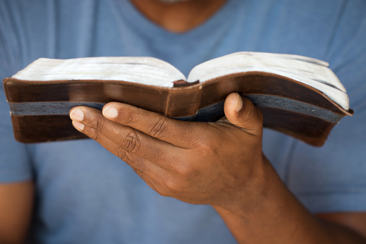 Man holding a Bible