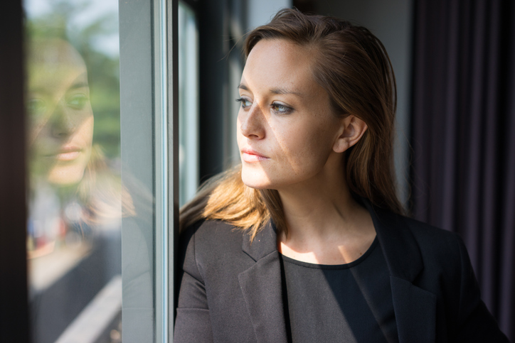 Pensive Business Lady Looking Through Window