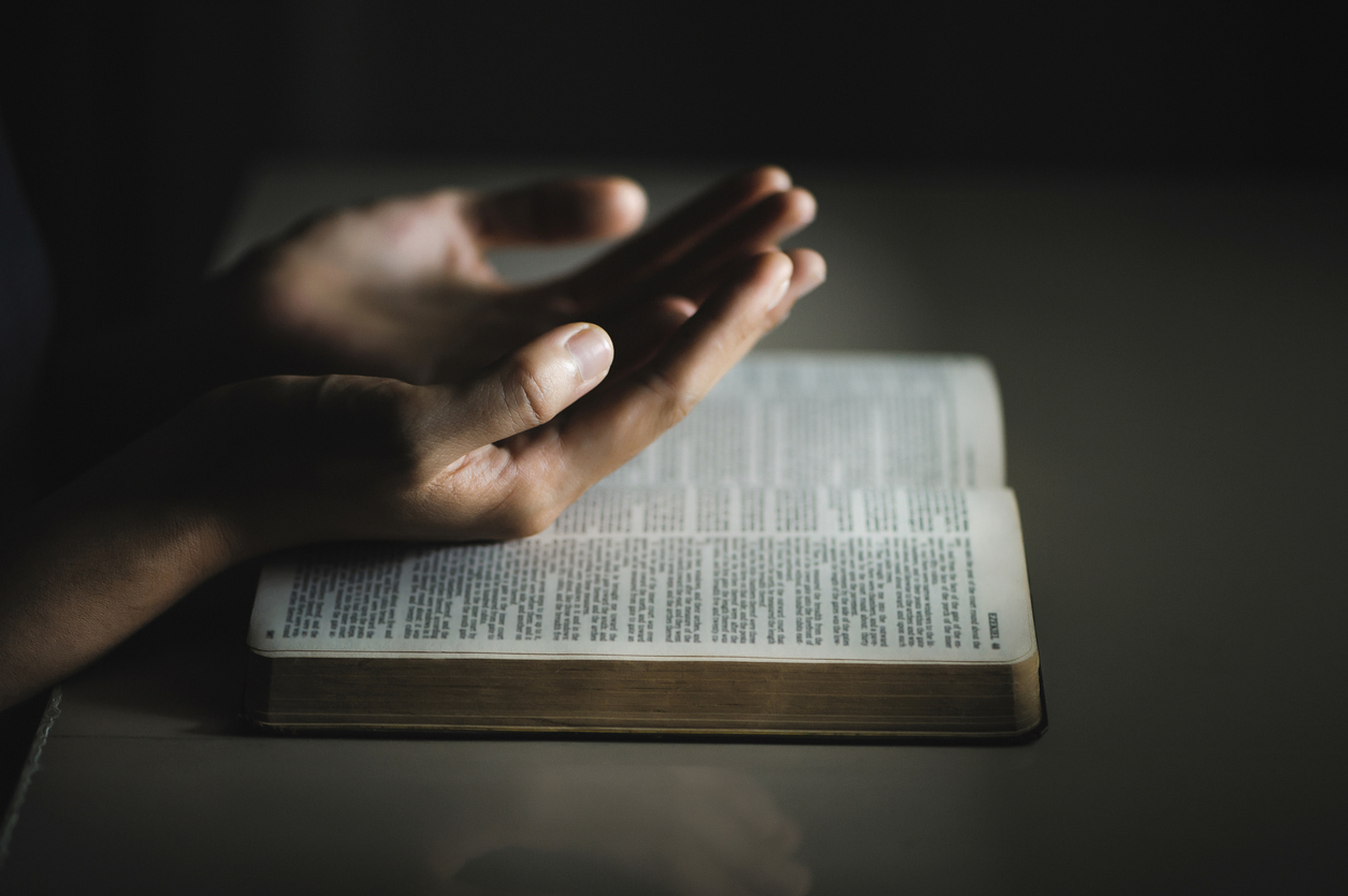 Women pray from god blessing to have a better life. Women hands praying to god with the bible. believe