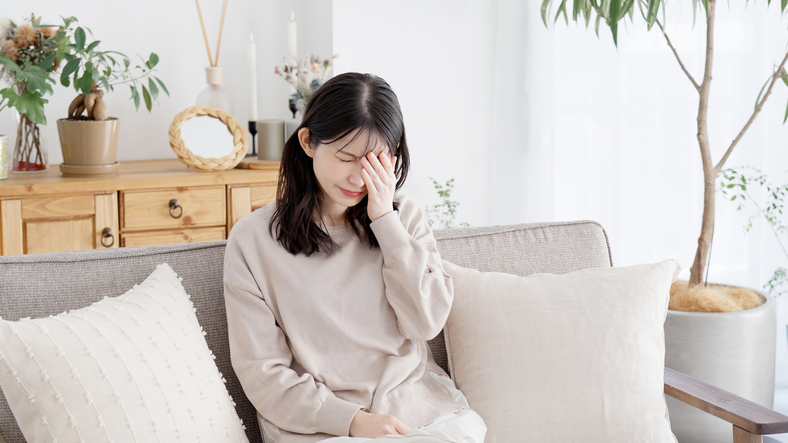 Woman holding her sore eyes