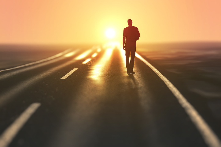 man goes on an empty road