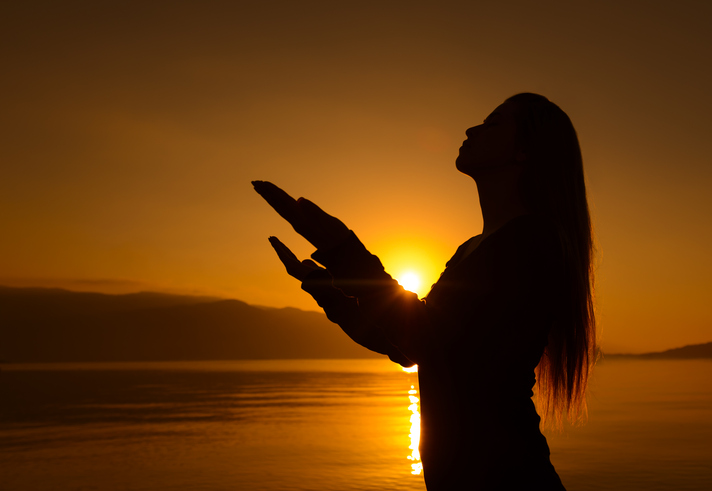 silhouette praying