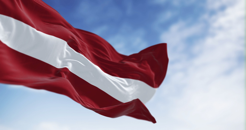 Republic of Latvia national flag waving in the wind on a clear day