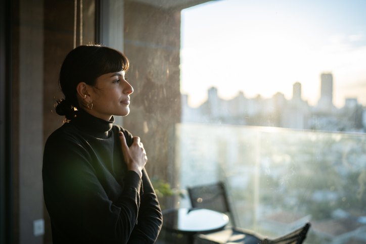 Young woman contemplating at home