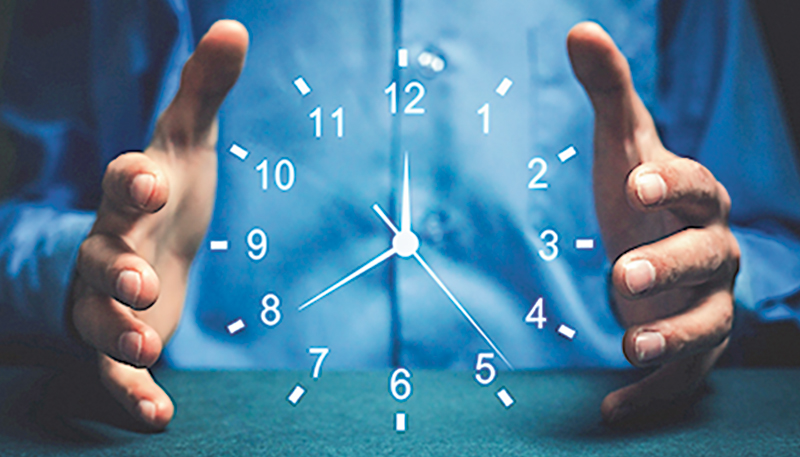 Businessman showing clock. Concept of saving time.