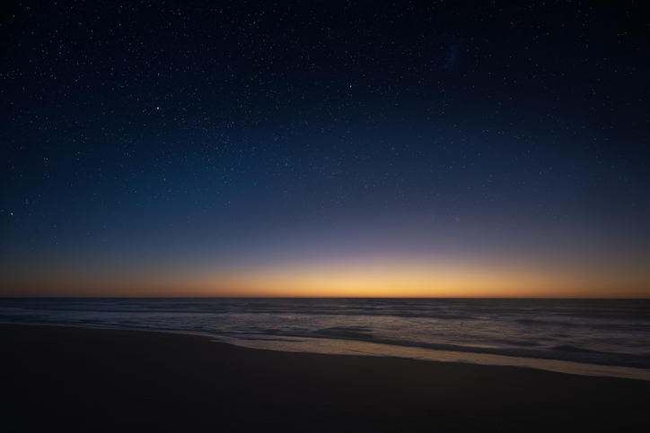 Amazing panoramic view of the Milky Way vanishing above the coast line of the Atlantic Ocean