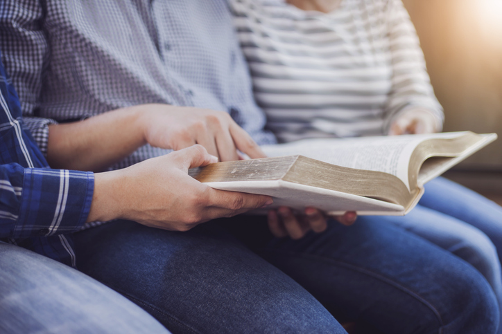 Christian friends group reading and study the bible together