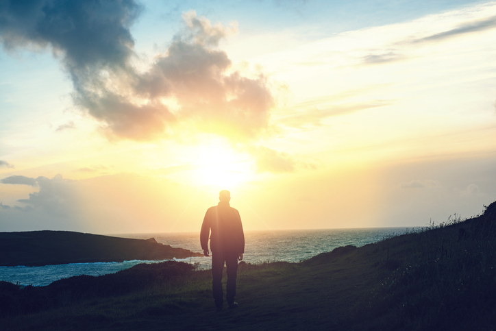Man walking at Sunset, Pentire Headland, Newquay, Cornwall, September