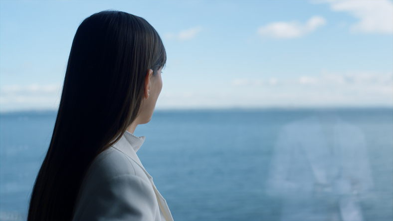 Closeup melancholic woman looking panoramic window. Business lifestyle concept