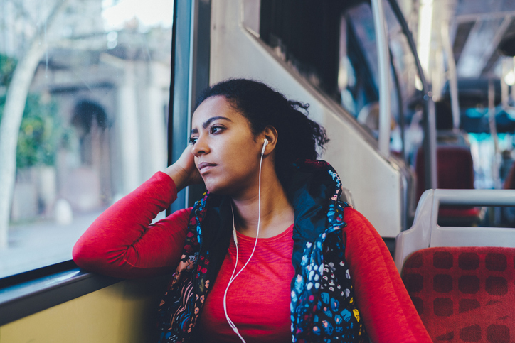 Mixed race woman traveling in bus