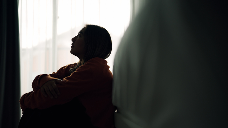 Woman depression in bedroom.