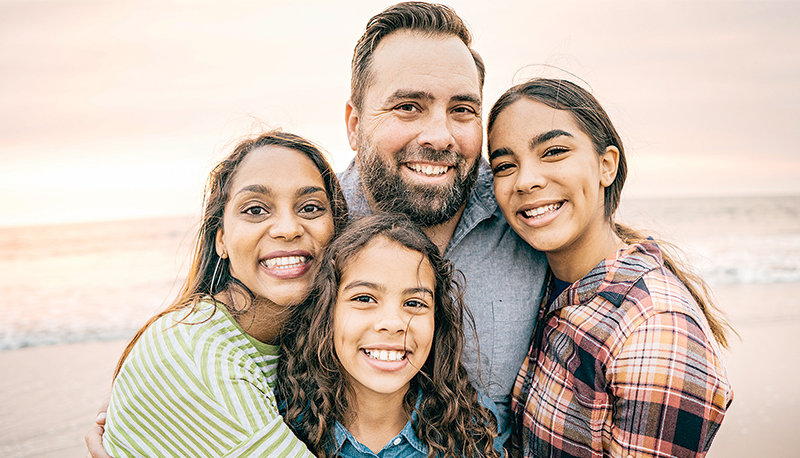 Smiling parents with two children