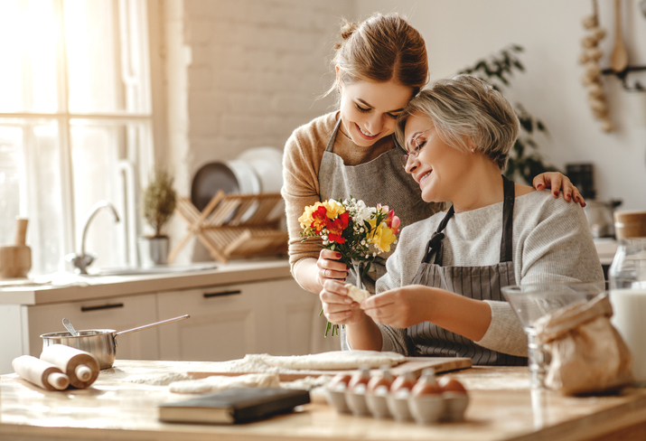 happy mother’s day! family old grandmother  mother-in-law and daughter-in-law daughter congratulate on   holiday, give flowers