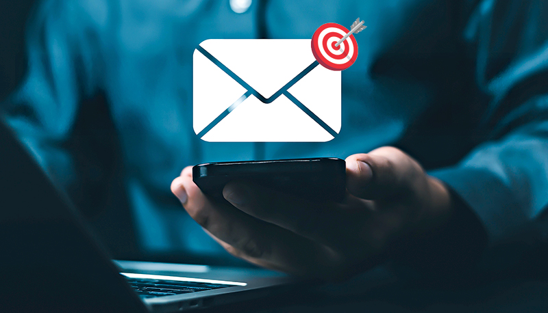 Businessman using smartphone with digital email notification icons, representing online communication, message alert, and email marketing in modern business technology and digital networking.