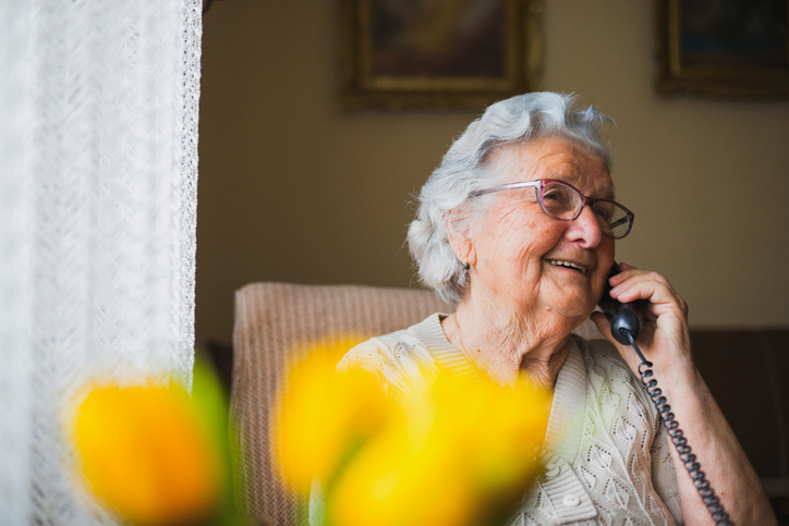 Portrait of an older woman talking with the phone